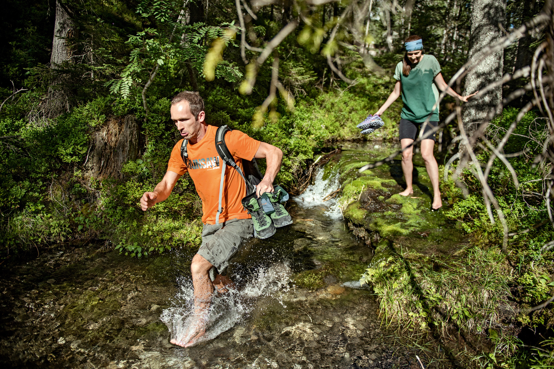 People wearing clothes from the STIHL collections in the forest